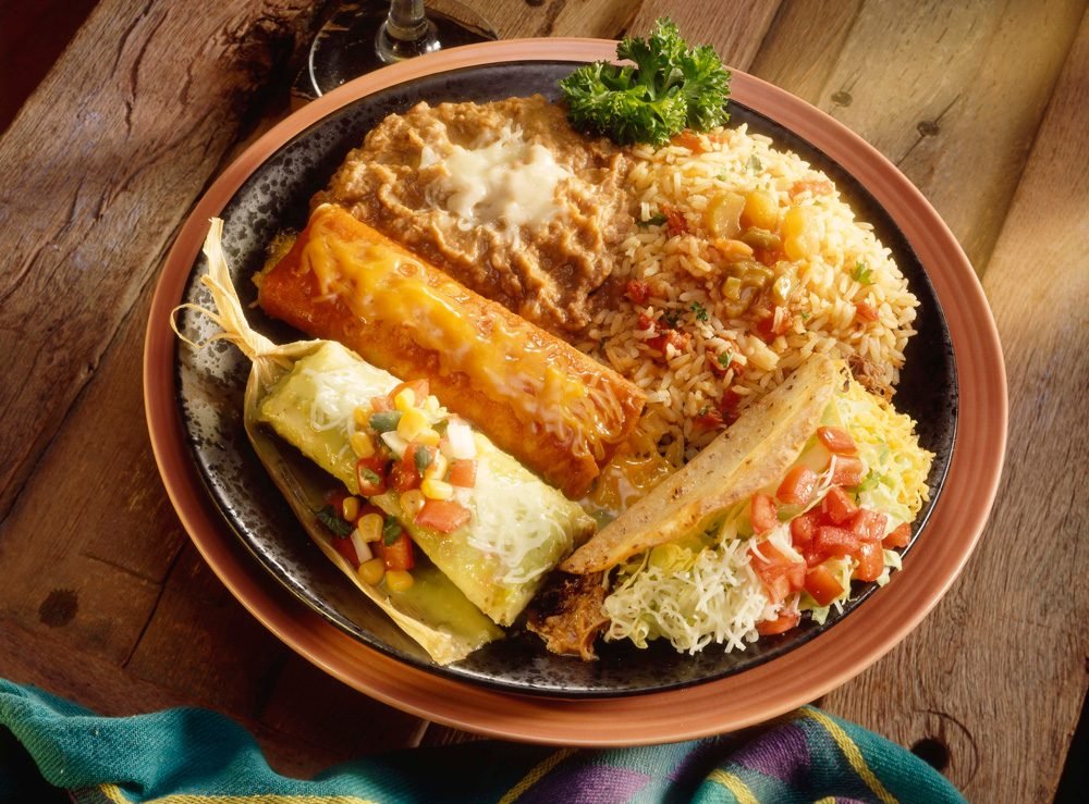 Enchiladas baked and served in a clay dish