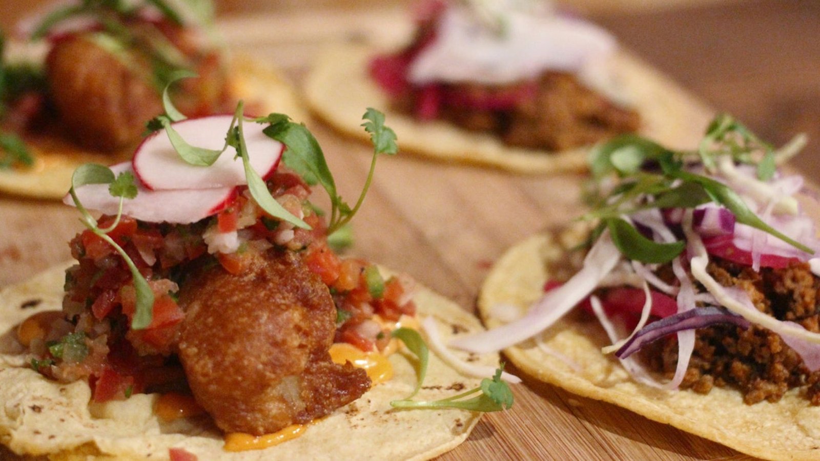Assorted tacos with pico de gallo, radish and cilantro