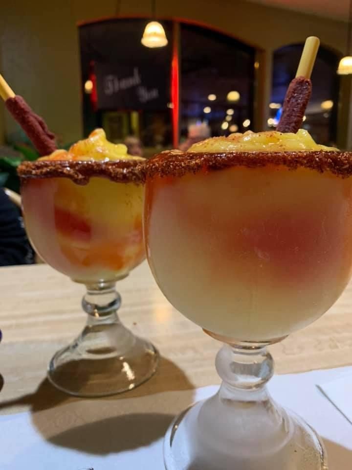 Two large margaritas rimmed with chamoy and tamarind